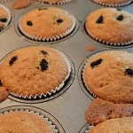 Mulberry muffins in a cooking tray coming out of the oven ready to eat